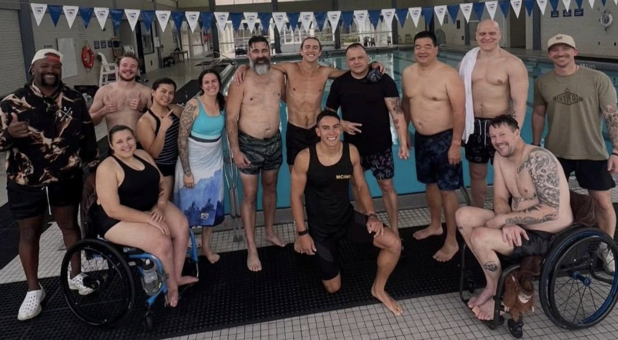 Eric Rush with adaptive athletes at the pool